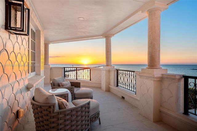 balcony featuring a water view