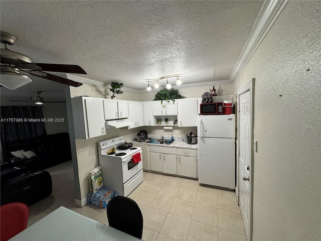 kitchen featuring crown molding, a textured wall, white cabinets, white appliances, and under cabinet range hood