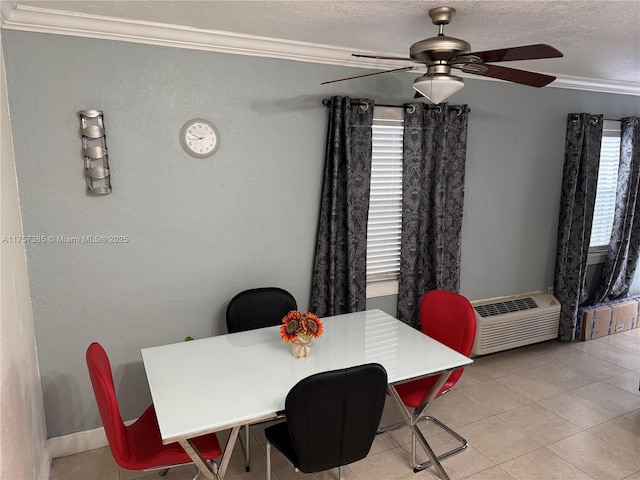 dining room with light tile patterned floors, ceiling fan, a wall mounted air conditioner, crown molding, and a textured ceiling