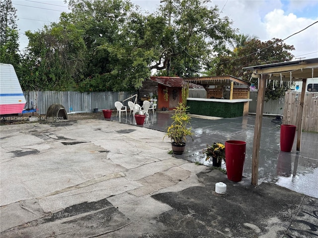 view of patio / terrace featuring fence