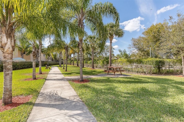 view of property's community with a yard