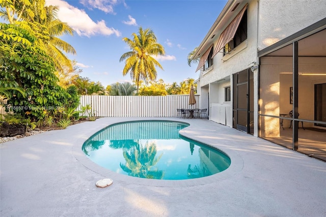 view of swimming pool featuring a patio area, a fenced backyard, and a fenced in pool