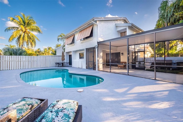 view of swimming pool featuring a fenced in pool, a patio, and fence