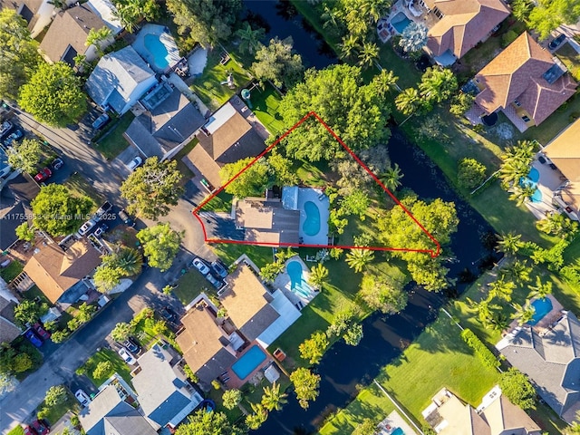 birds eye view of property with a residential view