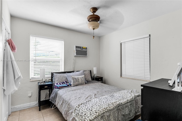 6830 SW 5th Ter, Miami, FL 33144 - bedroom with light tile patterned floors, baseboards, an AC wall unit, and a ceiling fan