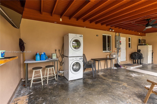 6830 SW 5th Ter, Miami, FL 33144 - laundry area featuring wood ceiling, ceiling fan, laundry area, and stacked washing maching and dryer