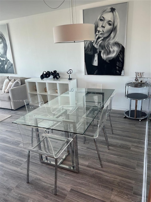 dining area with wood finished floors