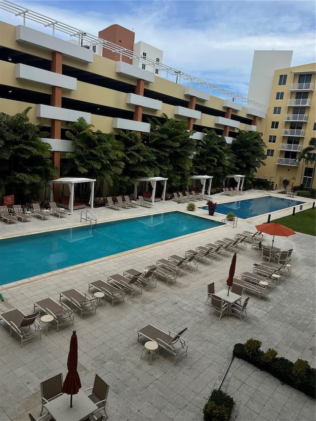 community pool featuring a patio area and a pergola