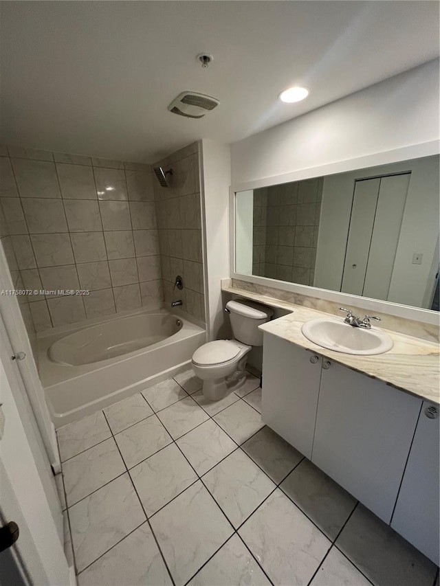 bathroom with bathtub / shower combination, vanity, and toilet