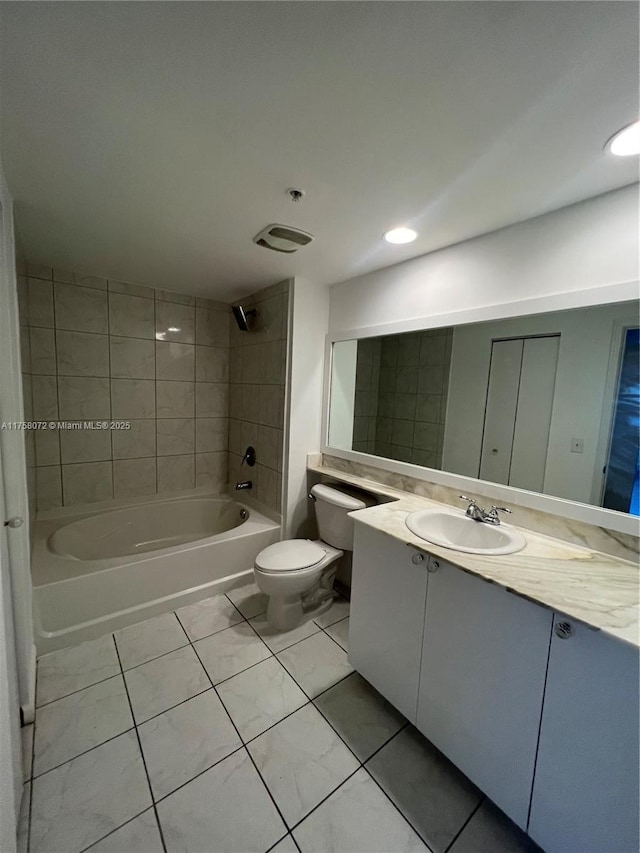 bathroom featuring toilet, shower / washtub combination, and vanity