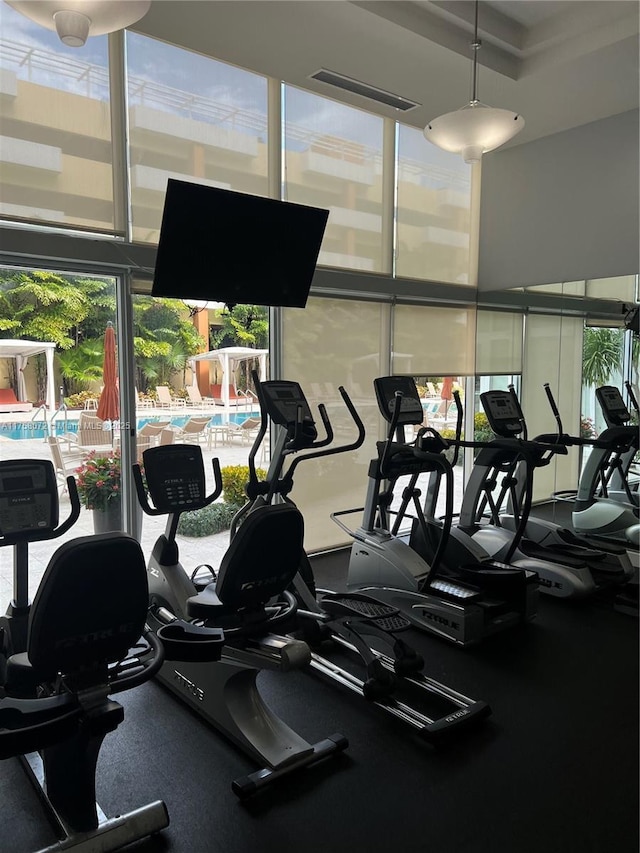 exercise room featuring visible vents and plenty of natural light