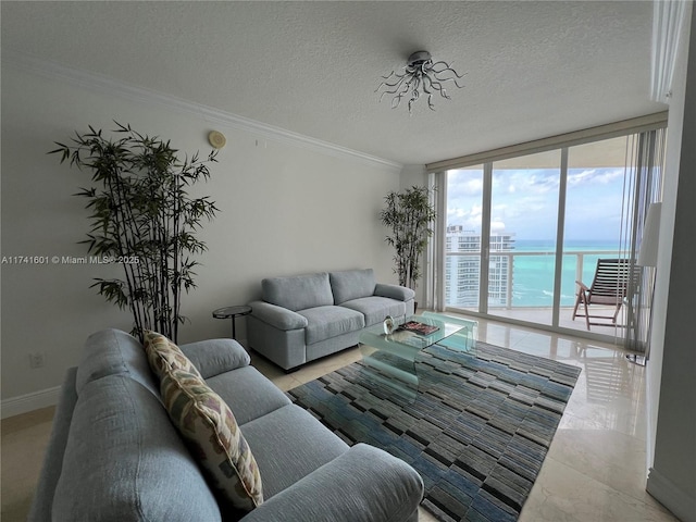 living room featuring a textured ceiling, a water view, baseboards, ornamental molding, and expansive windows