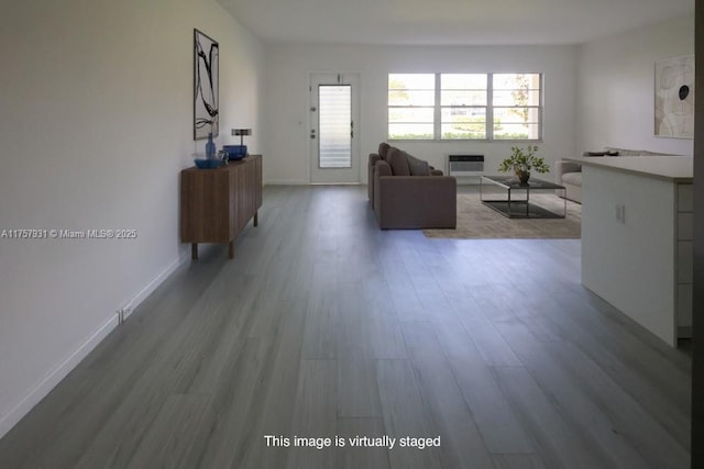 345 Preston I Unit 345, Boca Raton, FL 33434 - living area featuring wood finished floors, baseboards, and a wall unit AC