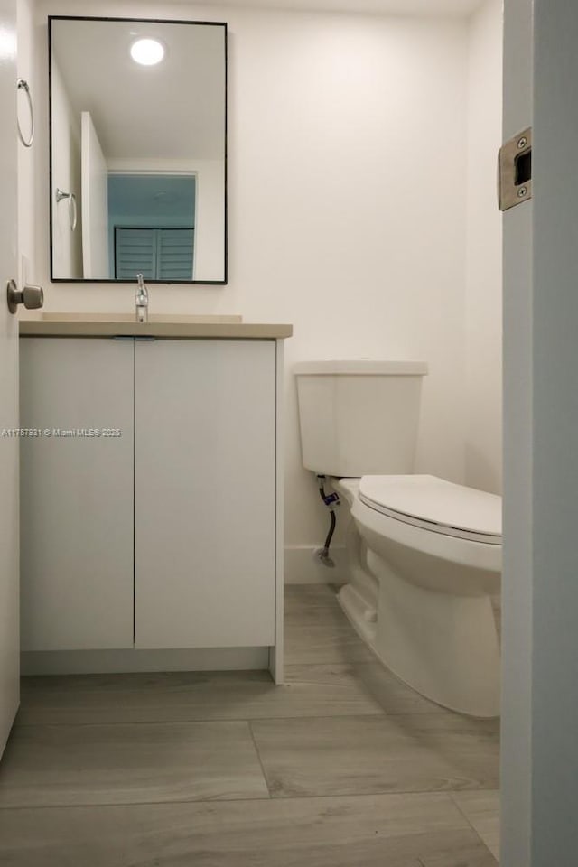 345 Preston I Unit 345, Boca Raton, FL 33434 - bathroom with toilet, vanity, and baseboards