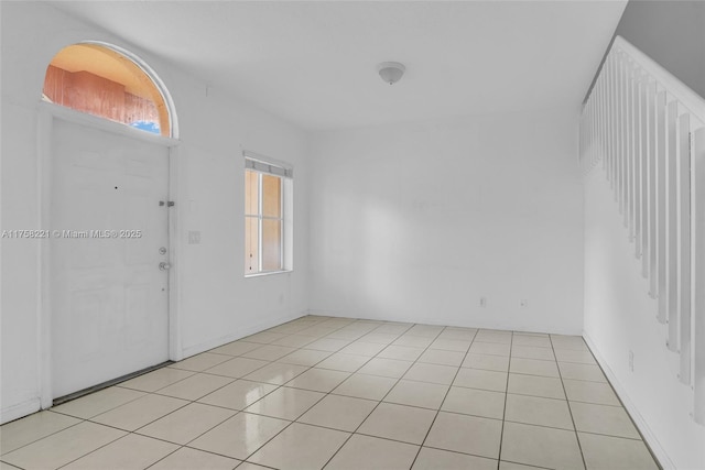 entrance foyer with light tile patterned floors