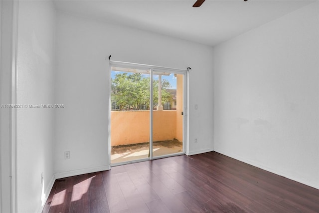 spare room with ceiling fan, baseboards, and wood finished floors