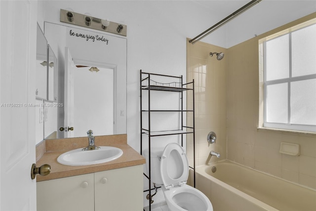 full bath featuring vanity, bathtub / shower combination, and toilet