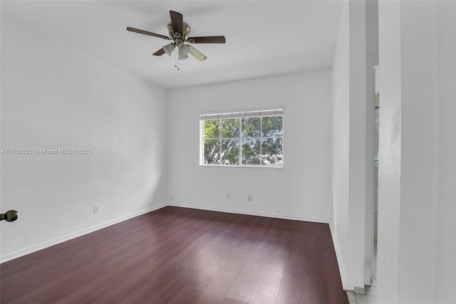 empty room with ceiling fan, baseboards, and wood finished floors