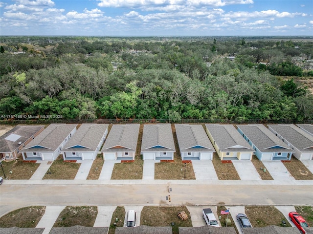 bird's eye view featuring a view of trees