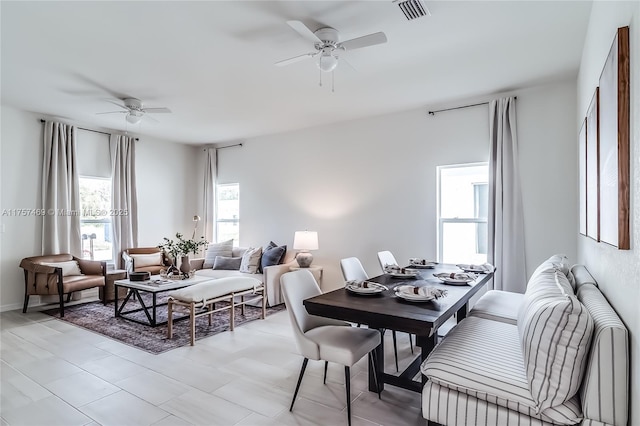 dining space featuring a ceiling fan and visible vents