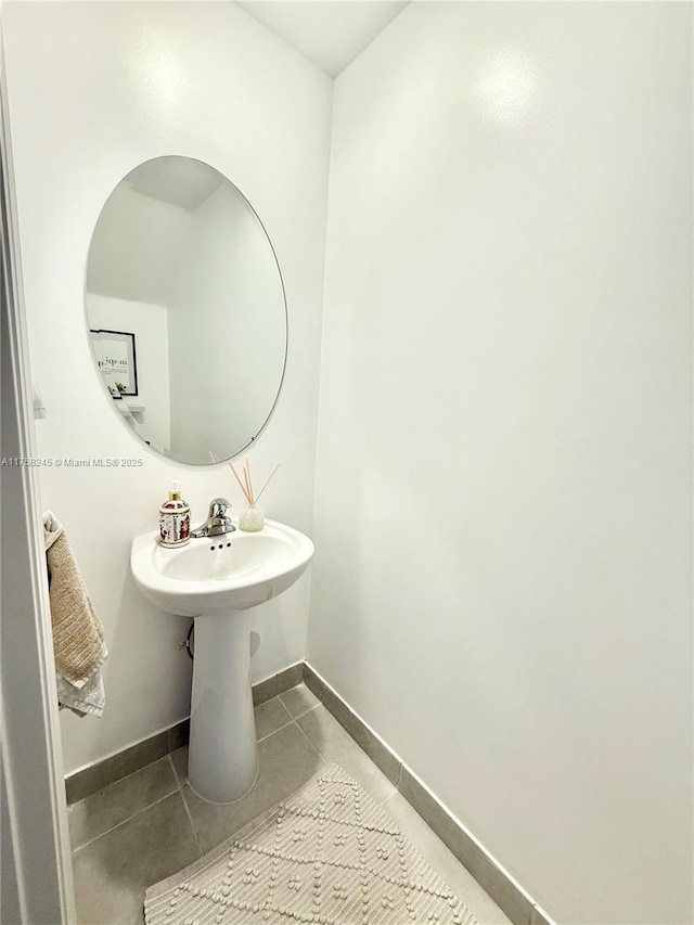 bathroom featuring baseboards and tile patterned floors