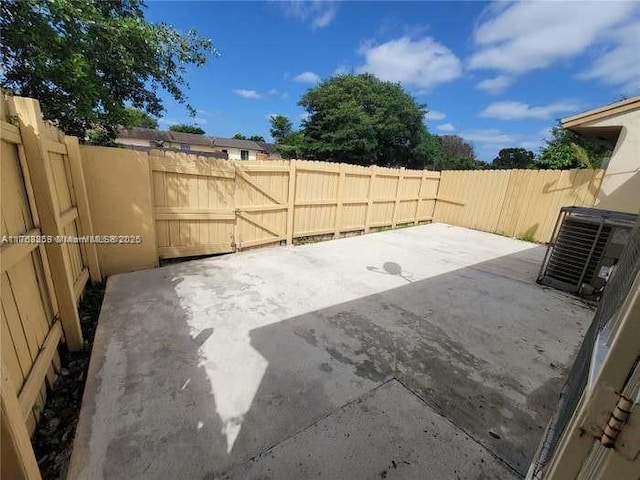 view of patio / terrace featuring a fenced backyard and central AC unit