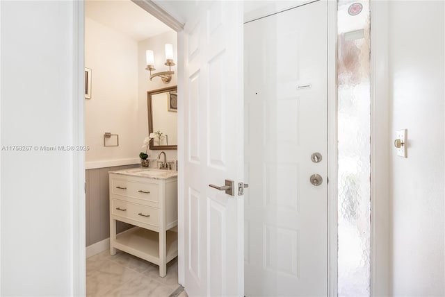 bathroom featuring tile patterned flooring and vanity