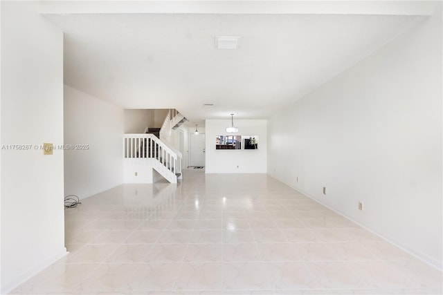 unfurnished living room with light tile patterned floors, stairs, and visible vents