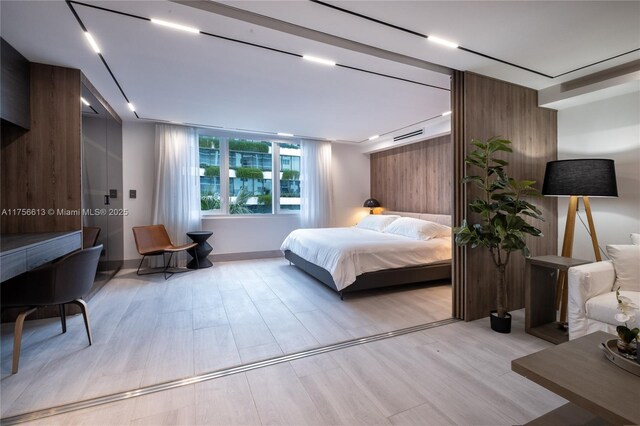 2301 Collins Ave Unit 432, Miami Beach, FL 33139 - bedroom featuring light wood-type flooring
