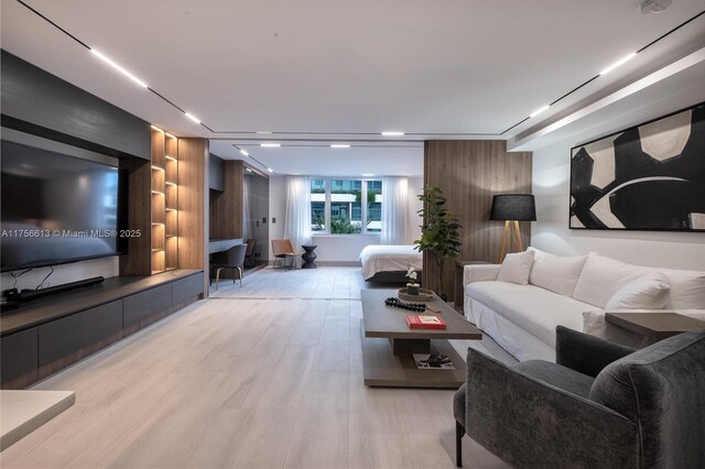 2301 Collins Ave Unit 432, Miami Beach, FL 33139 - living area featuring light wood finished floors and built in features