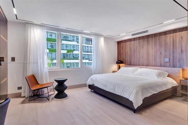 2301 Collins Ave Unit 432, Miami Beach, FL 33139 - bedroom featuring wood finished floors and baseboards