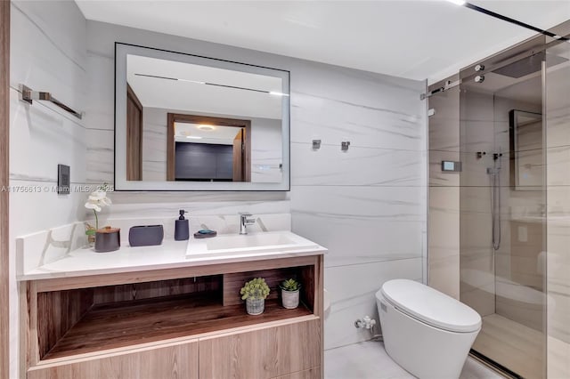 bathroom with toilet, a shower stall, tile walls, and vanity