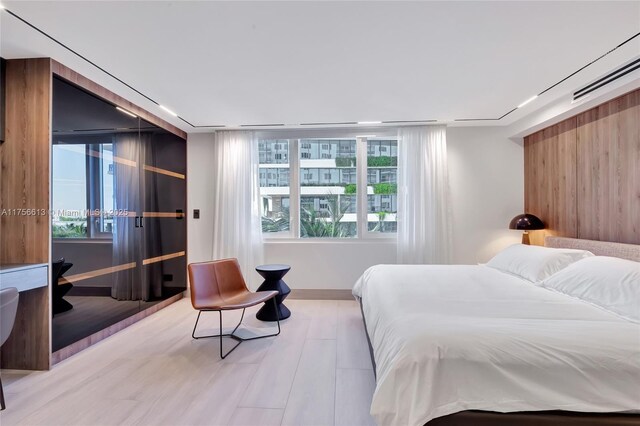2301 Collins Ave Unit 432, Miami Beach, FL 33139 - bedroom with wood finished floors and baseboards
