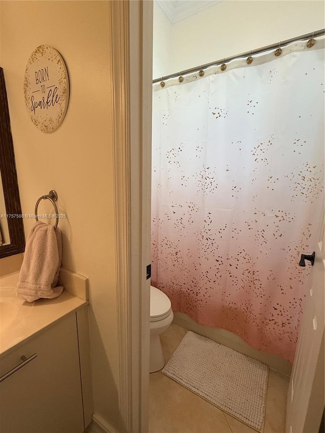 bathroom featuring tile patterned flooring, a shower with shower curtain, vanity, and toilet