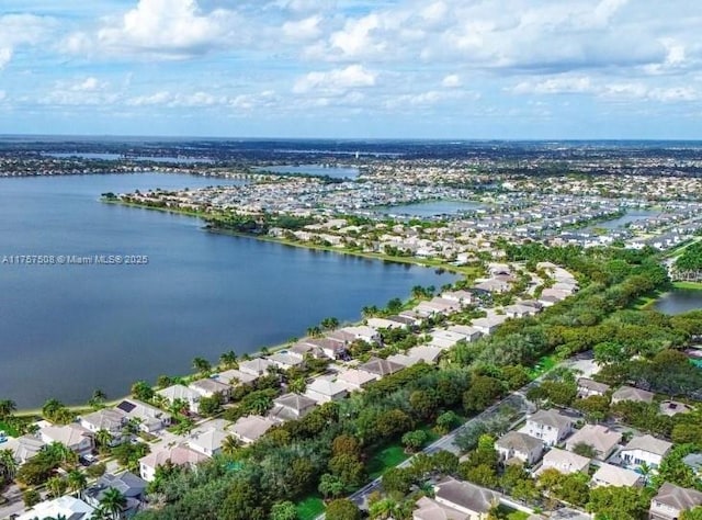 bird's eye view featuring a residential view and a water view