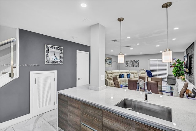 kitchen with open floor plan, marble finish floor, and recessed lighting