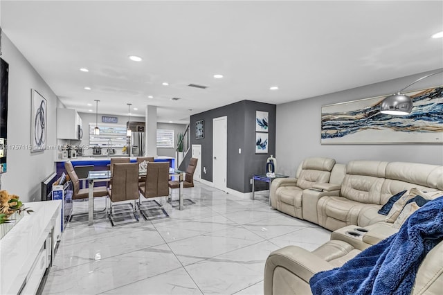 living room featuring recessed lighting, marble finish floor, visible vents, and baseboards