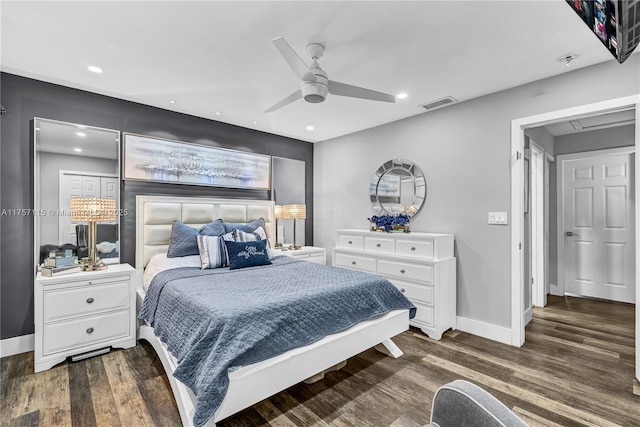 bedroom featuring recessed lighting, wood finished floors, visible vents, and baseboards