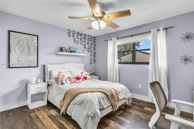 bedroom with wood finished floors, a ceiling fan, and baseboards