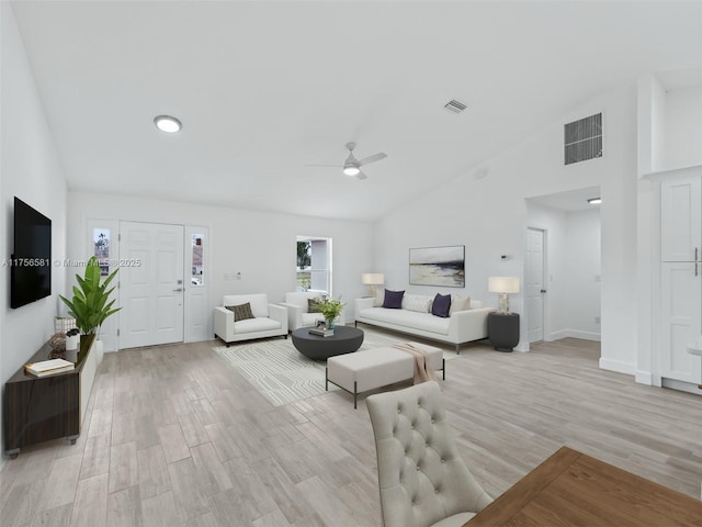 unfurnished living room with light wood-style floors, visible vents, ceiling fan, and baseboards