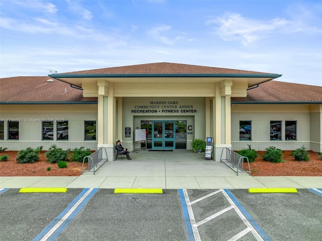 view of building exterior featuring uncovered parking