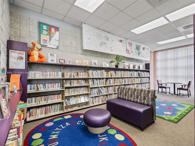 game room with a drop ceiling and visible vents