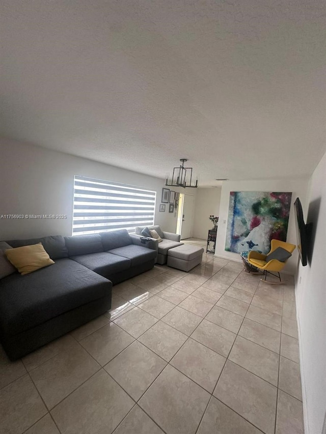 living room featuring light tile patterned floors and a textured ceiling