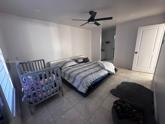 tiled bedroom featuring a ceiling fan