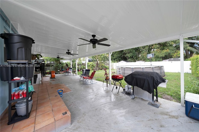 view of patio with a fenced in pool, a fenced backyard, a grill, and a ceiling fan