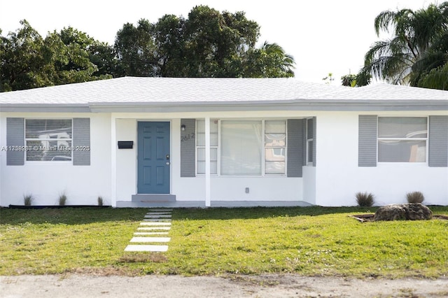 2612 Rodman St, Hollywood, FL 33020 - ranch-style home with a front yard and stucco siding