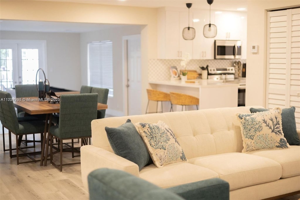 living room featuring recessed lighting and light wood-style floors