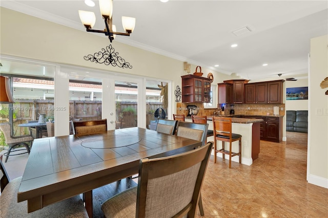 dining area with an inviting chandelier, visible vents, ornamental molding, and recessed lighting