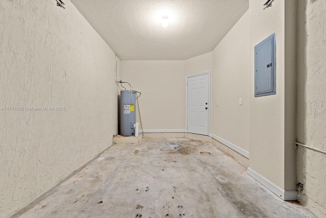 garage with baseboards, electric water heater, and electric panel