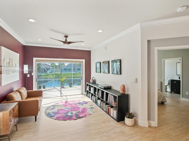 interior space featuring recessed lighting, crown molding, baseboards, and wood finished floors